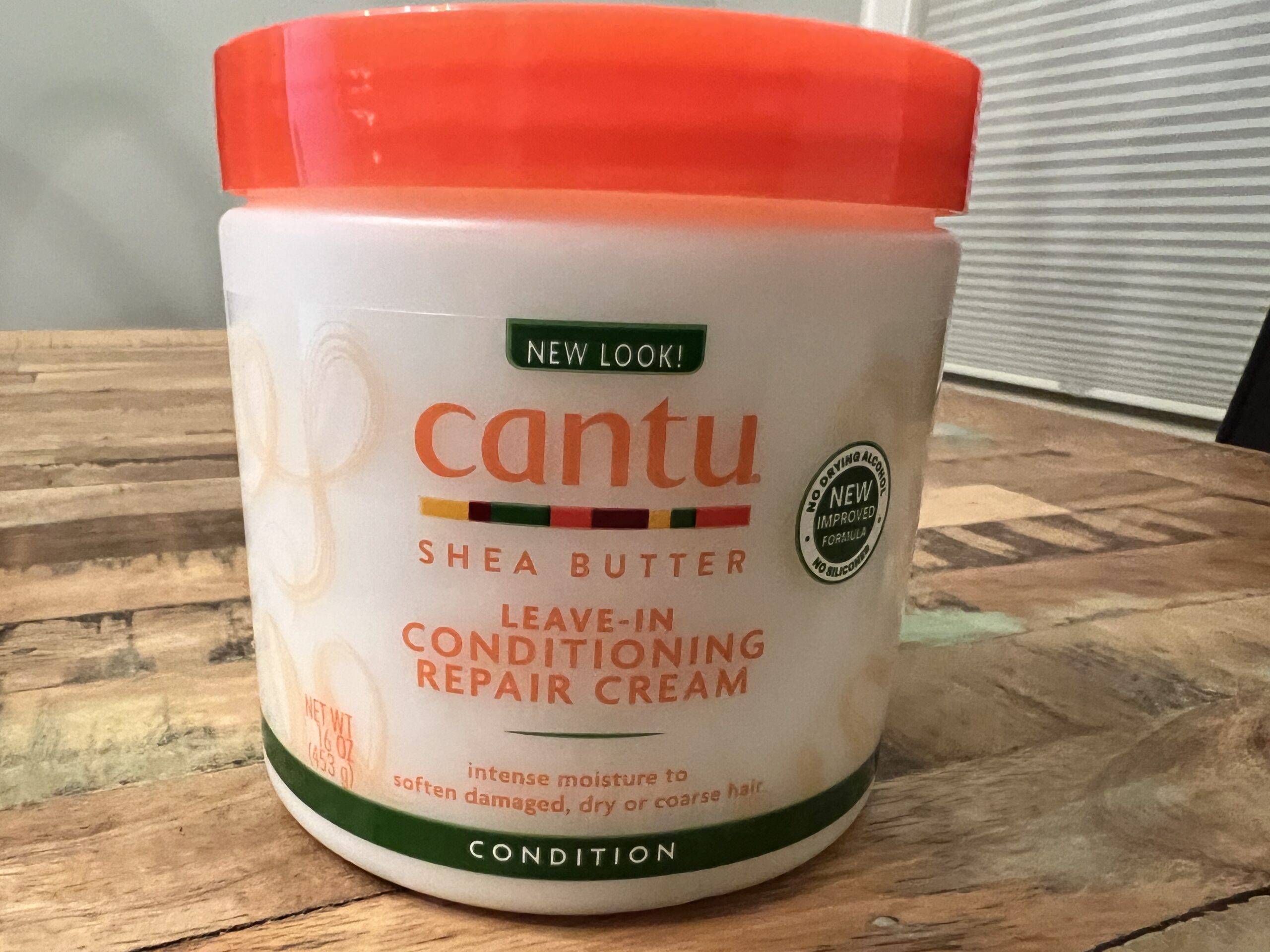 Bottle of Cantu Shea Butter Leave-In Conditioning Repair Cream, targeted for softening and repairing dry, damaged hair.