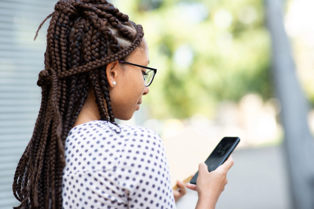 Box braids seen from behind, with the square scalp partings clearly visible