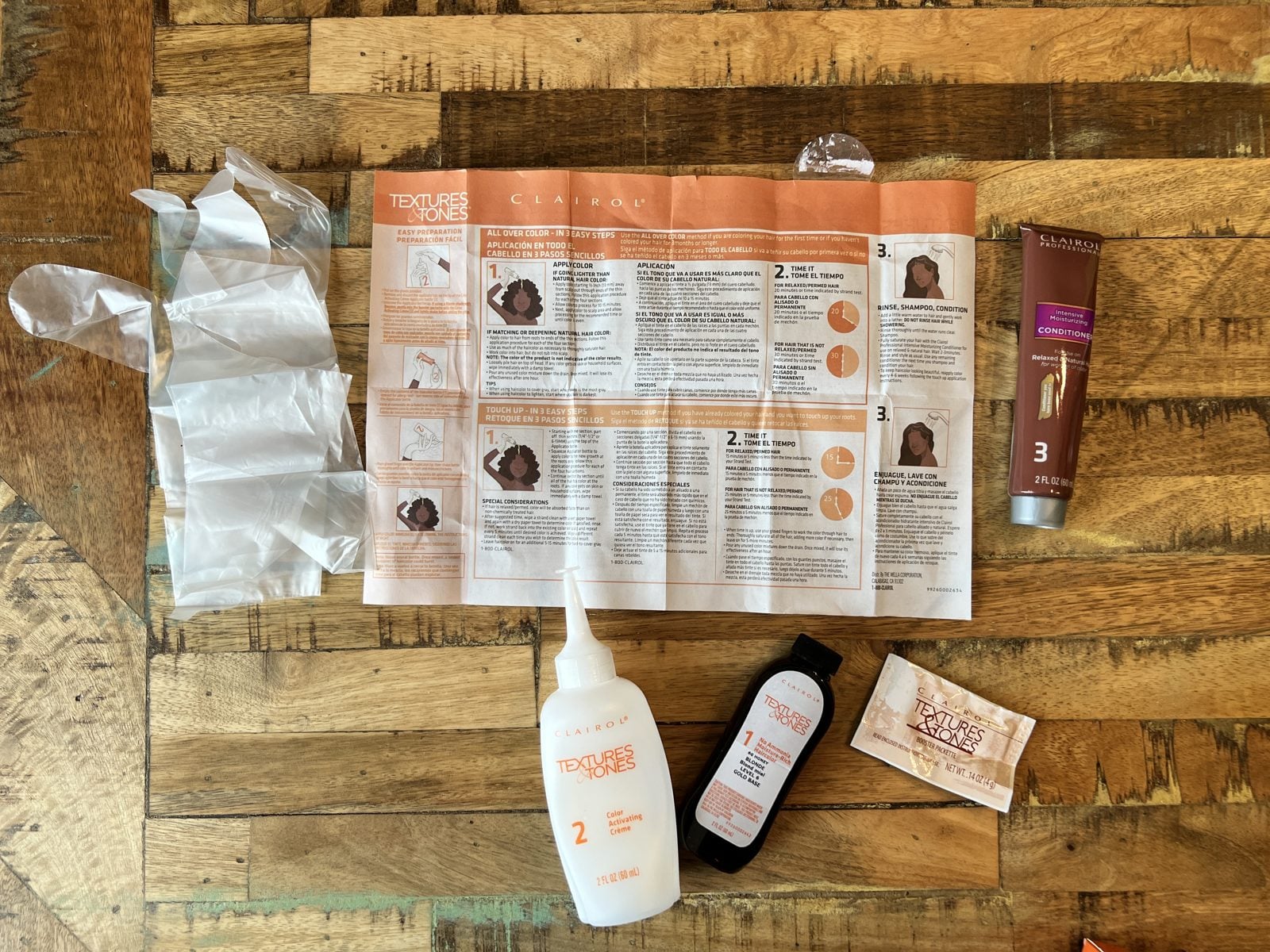 Textures and Tones kit spread on a wood table: instructions, gloves, color, activator, and conditioner
