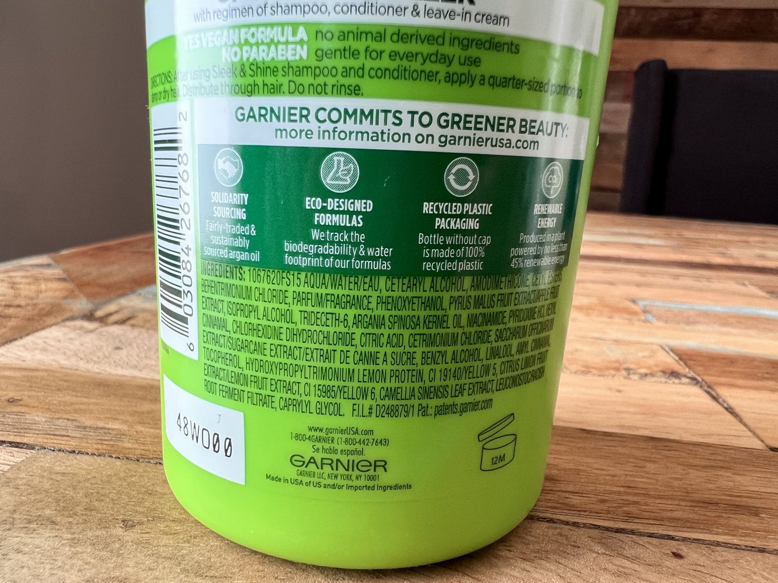 Back label of Garnier Fructis Sleek and Shine Leave-In Conditioning Cream with its ingredient list
