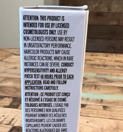 Hair color box warning, close up: conduct hypersensitivity and allergy patch test 48 hours prior to each application